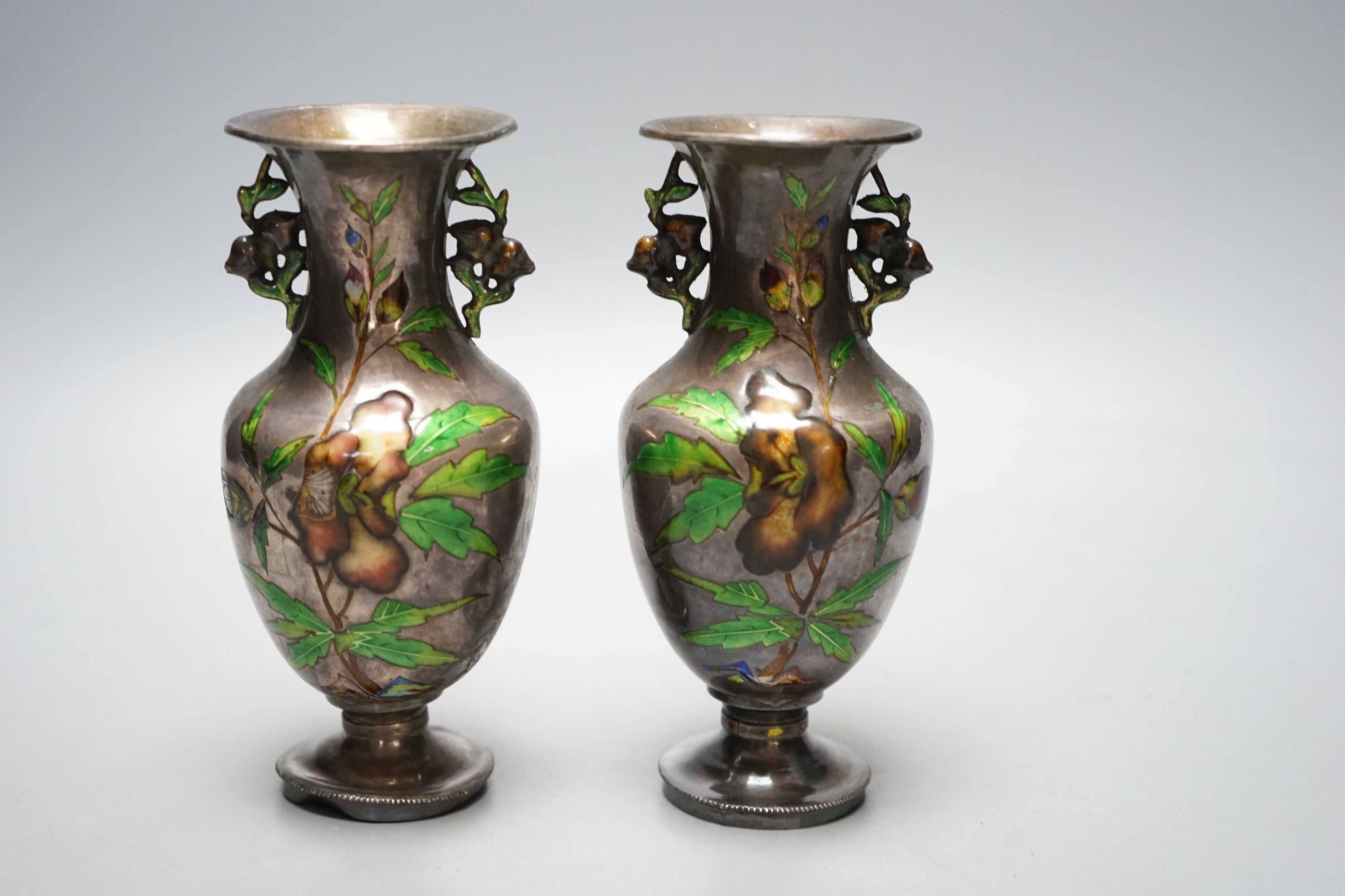 A pair of nice quality Chinese silver and enamel vases, late 19th century, 15 cms high.